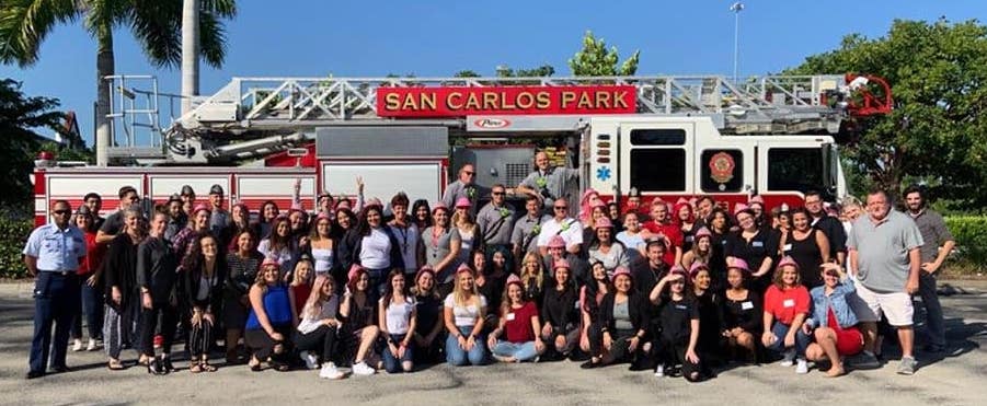 Students and firefighters in front of fire engine