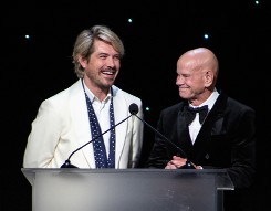 Taylor Hanson and Winn Claybaugh speaking at a podium