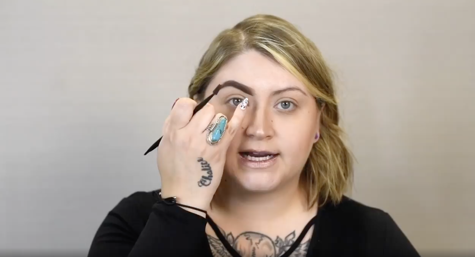 Instructor pointing at a section near their eyebrow